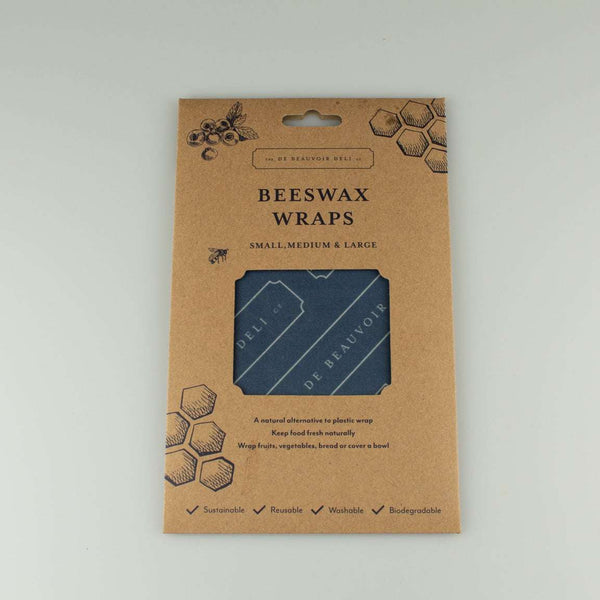 Beeswax wraps in small, medium, and large sizes, presented in a brown kraft paper hanging card package with honeycomb illustrations.