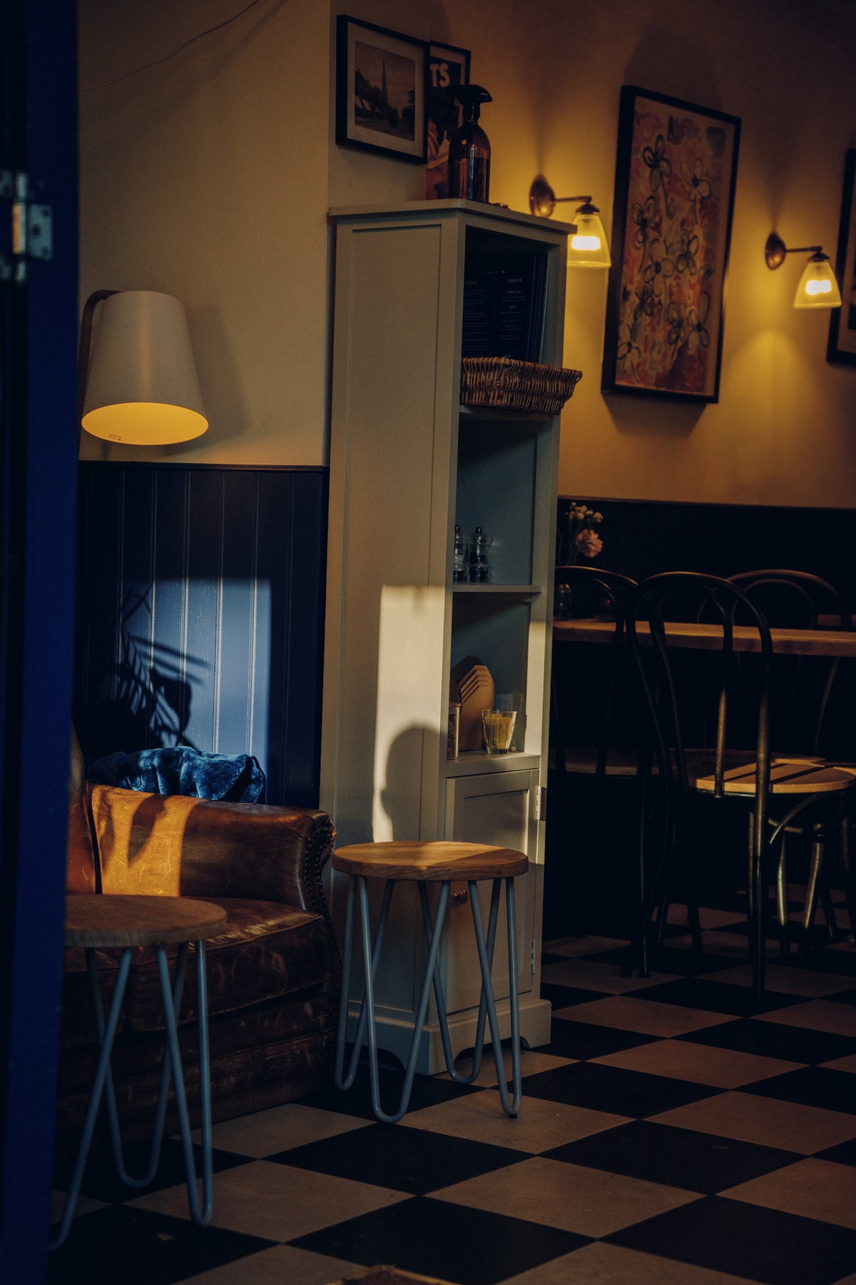 The warm interior of De Beauvoir Wines in the evening